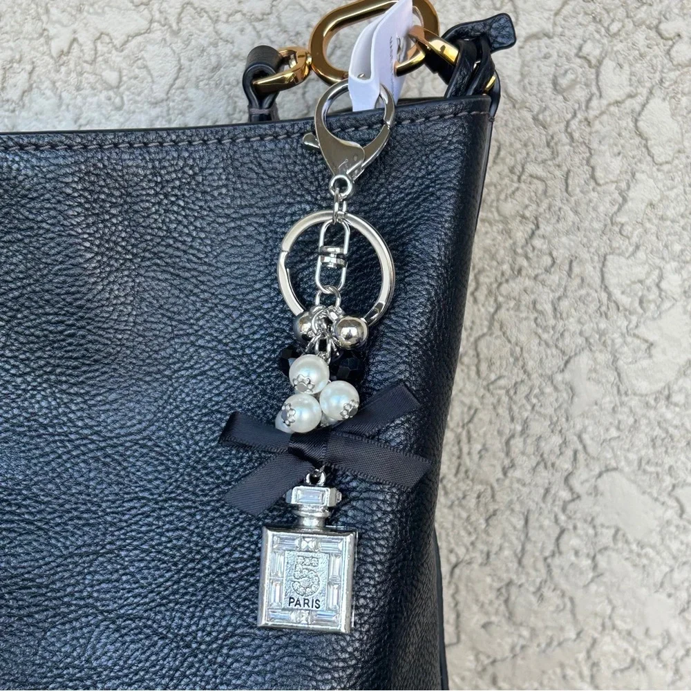 Luxe Silver Perfume Bottle Keychain/Bag Charm with Black Bow